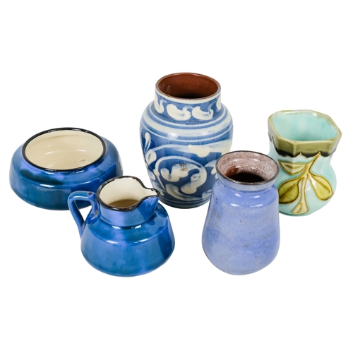 206 - A tubeline vase in the manner of Moorcroft - decorated with a leaf and flower on a pale blue ground,... 