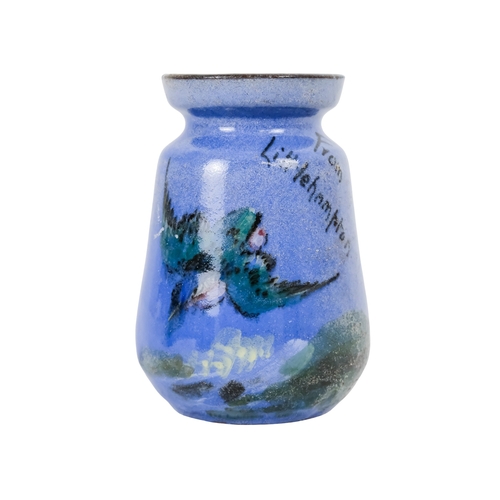 206 - A tubeline vase in the manner of Moorcroft - decorated with a leaf and flower on a pale blue ground,... 