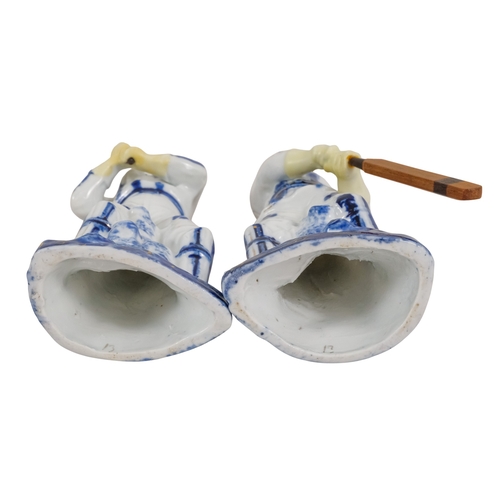 216 - A pair of early 20th century cricketing figures - each in a batting pose, 19cm high. (2)