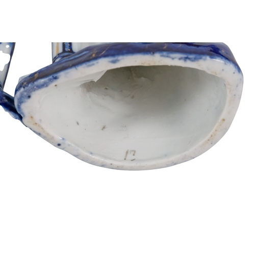 216 - A pair of early 20th century cricketing figures - each in a batting pose, 19cm high. (2)