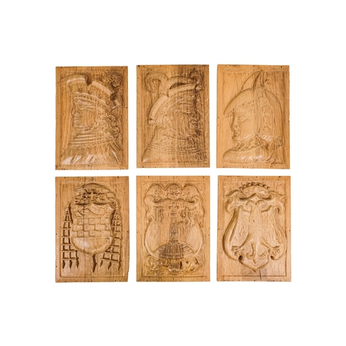 127 - A group of six 15th century style carved oak panels  - decorated with pseudo family coats of arms, 1... 
