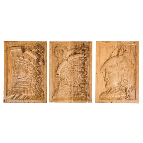 127 - A group of six 15th century style carved oak panels  - decorated with pseudo family coats of arms, 1... 