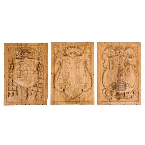 127 - A group of six 15th century style carved oak panels  - decorated with pseudo family coats of arms, 1... 