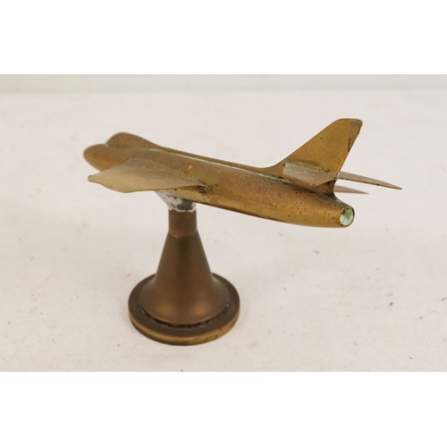 144 - A brass aeroplane mascot - height 15cm, length 20cm.