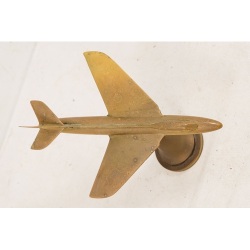144 - A brass aeroplane mascot - height 15cm, length 20cm.
