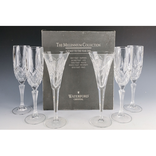 150 - A pair of Waterford crystal glass champagne flutes, boxed - together with four other champagne flute... 