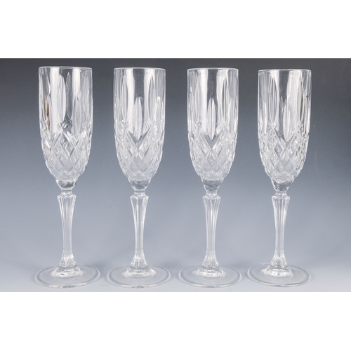 150 - A pair of Waterford crystal glass champagne flutes, boxed - together with four other champagne flute... 