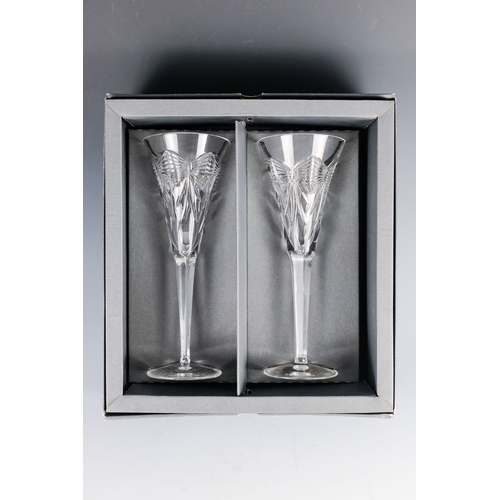 150 - A pair of Waterford crystal glass champagne flutes, boxed - together with four other champagne flute... 