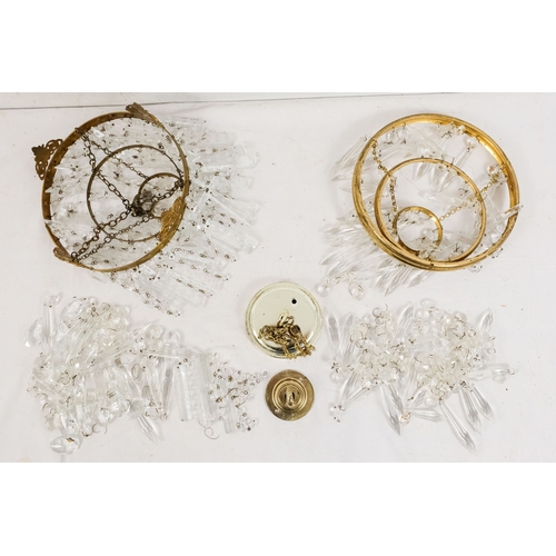 152 - A crystal chandelier, diameter 21cm - together with another crystal chandelier of similar proportion... 