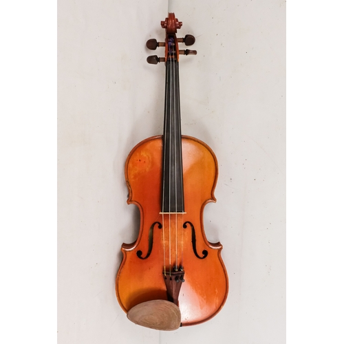 156 - A 20th century French violin - with a two piece back, together with two bows in a hard case with can... 