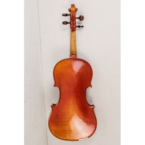 156 - A 20th century French violin - with a two piece back, together with two bows in a hard case with can... 