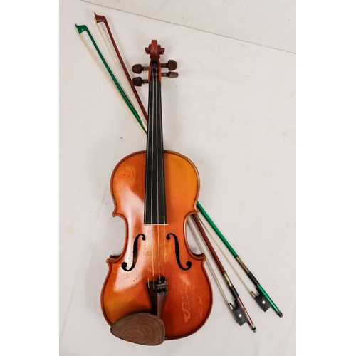 156 - A 20th century French violin - with a two piece back, together with two bows in a hard case with can... 