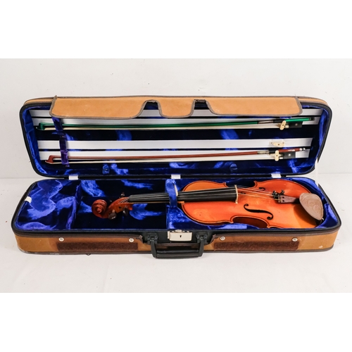 156 - A 20th century French violin - with a two piece back, together with two bows in a hard case with can... 