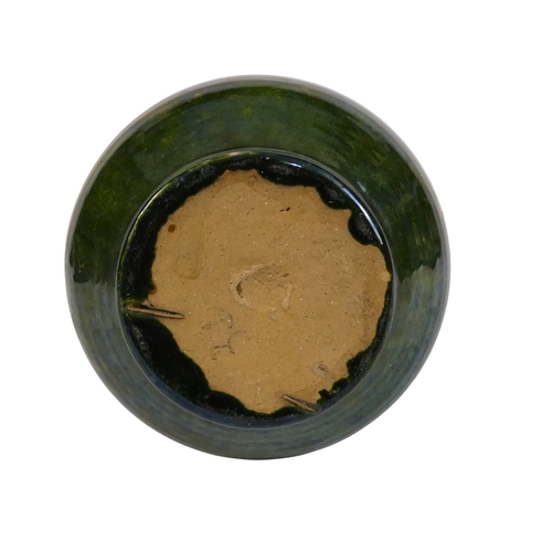 203 - A Biot Pottery style jug - with a green iridescent glaze, 21cm high.