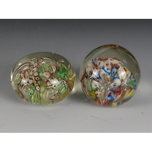 205 - A Wedgwood glass paperweight - set with an amber flower, 7cm diameter, together with four other simi... 