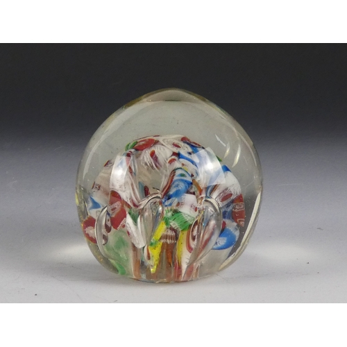 205 - A Wedgwood glass paperweight - set with an amber flower, 7cm diameter, together with four other simi... 