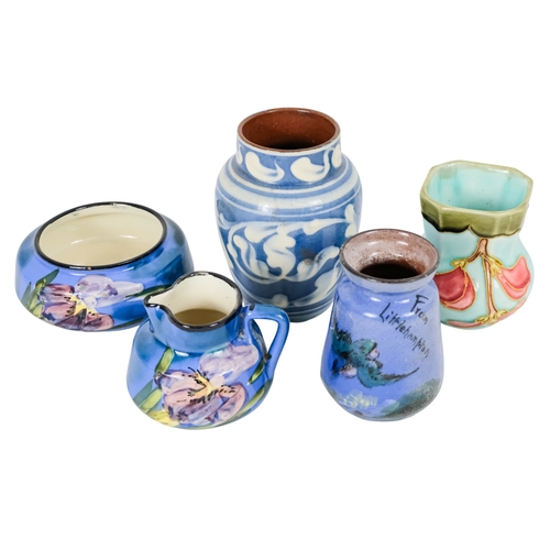 206 - A tubeline vase in the manner of Moorcroft - decorated with a leaf and flower on a pale blue ground,... 