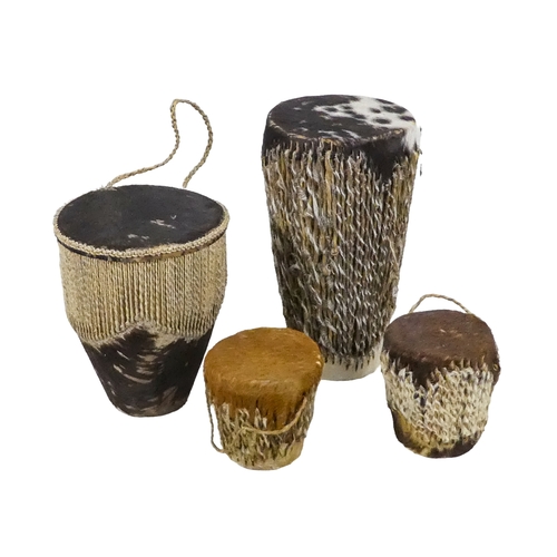 1155 - A collection of African carved hardwood figures - together with a walking cane, and four hide covere... 