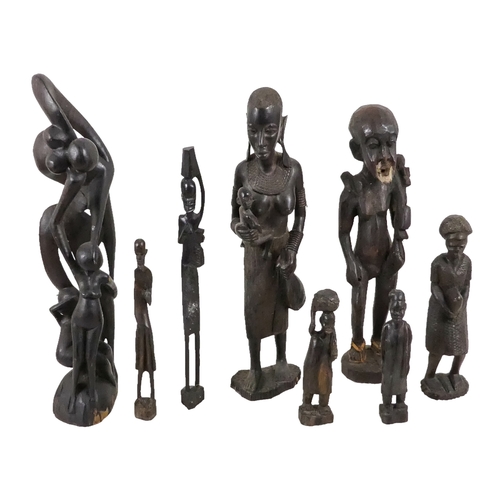 1155 - A collection of African carved hardwood figures - together with a walking cane, and four hide covere... 
