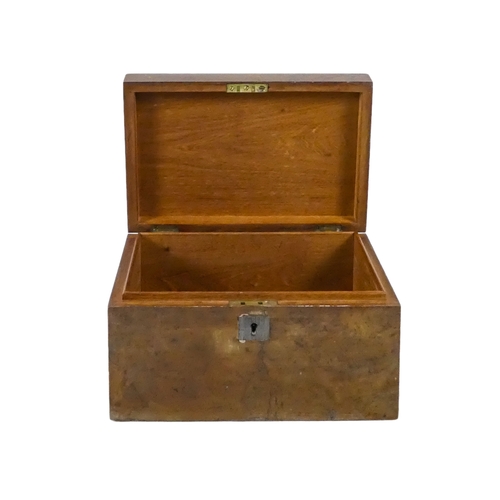 1156 - An early 20th century birdseye veneered box - rectangular with a white metal shield shaped vacant ca... 