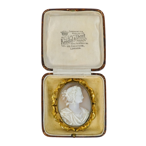303 - An Italian 19th century cameo brooch - carved with a portrait of a young woman, within a foliate gil... 