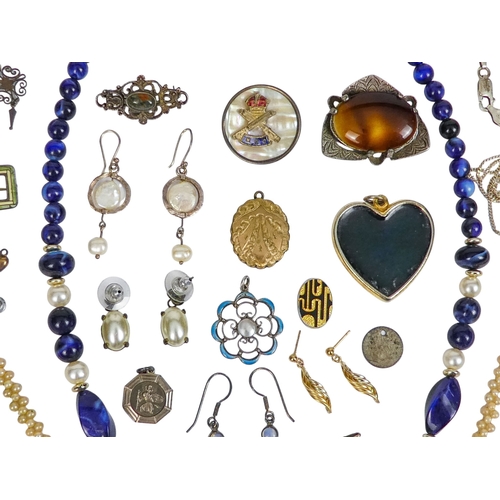 304 - A small quantity of costume jewellery - including a seed pearl necklace, a blue bead necklace and su... 