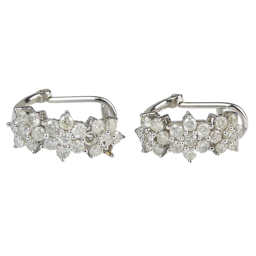 308 - A pair of white gold and diamond earrings - each with three foliate settings, one absent setting, 2.... 