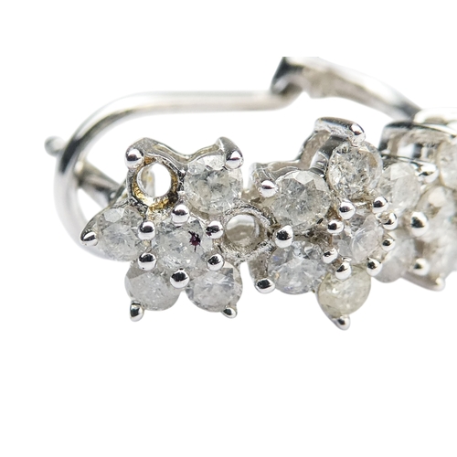 308 - A pair of white gold and diamond earrings - each with three foliate settings, one absent setting, 2.... 