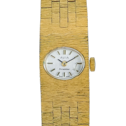 513 - An Avia ladies cocktail watch - the white oval dial set out with batons within ark finished case and... 