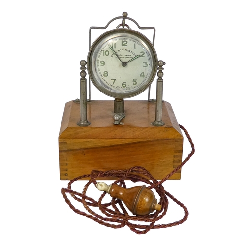 528 - An early 20th century walnut and nickel night pocket watch stand - of rectangular box form with stan... 