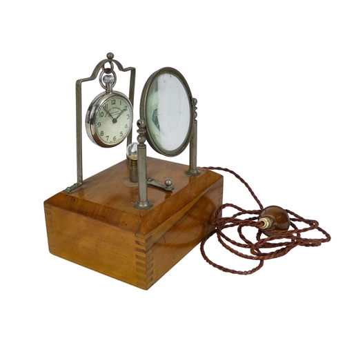 528 - An early 20th century walnut and nickel night pocket watch stand - of rectangular box form with stan... 