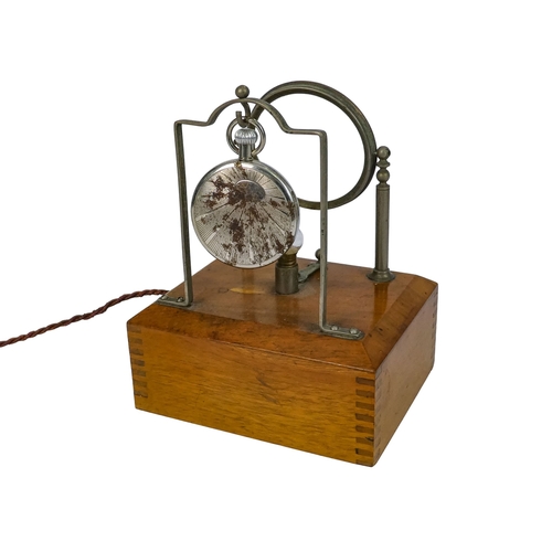528 - An early 20th century walnut and nickel night pocket watch stand - of rectangular box form with stan... 