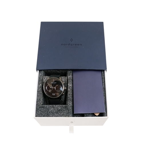 529 - A Nordgreen gentleman's wristwatch - the black dial with two subsidiary dials and date aperture, box... 