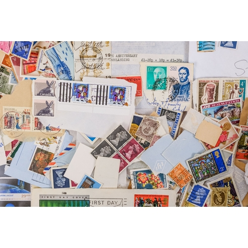 557 - A quantity of largely UK stamps - most on paper.