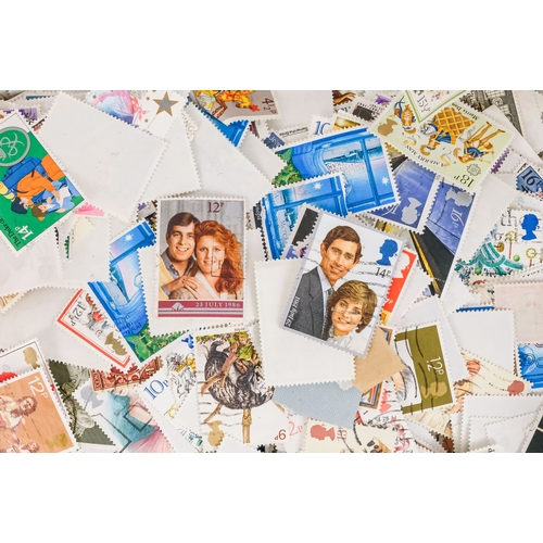 557 - A quantity of largely UK stamps - most on paper.