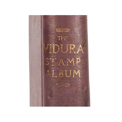 562 - An album of world and UK stamps - together with some loose stamps on paper and a First Day Cover.