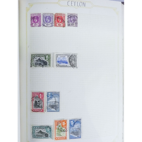 562 - An album of world and UK stamps - together with some loose stamps on paper and a First Day Cover.