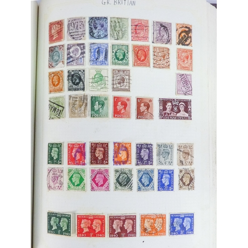 562 - An album of world and UK stamps - together with some loose stamps on paper and a First Day Cover.