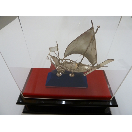 125 - 925 silver Arab dhow in display case