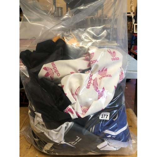 377 - 3/4 of a bag of sportsware
Nike, Adidas etc
from lost luggage