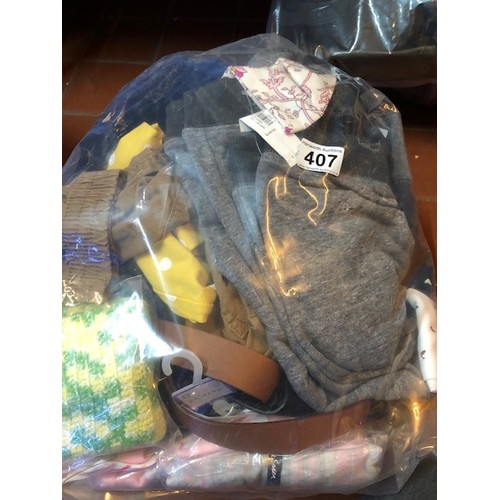 407 - 1/2 bag of new & tagged clothing
from lost luggage