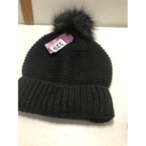 329 - New & tagged lady's bobble hat
Black