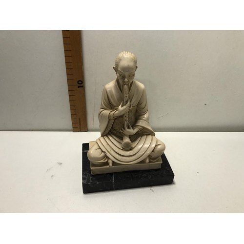 28 - Carved stone figure