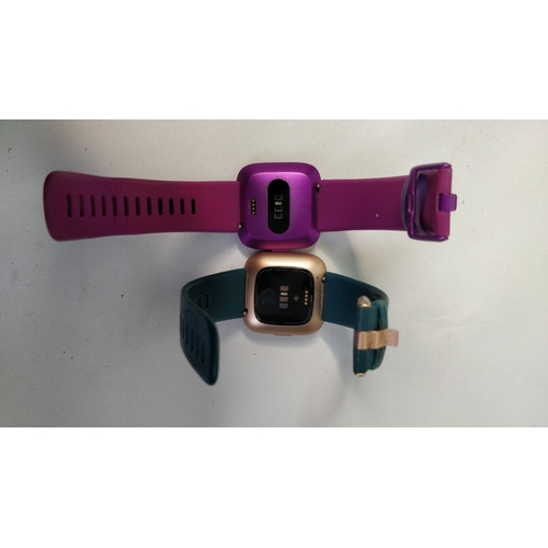 122 - 2 x fit bit watches no charger