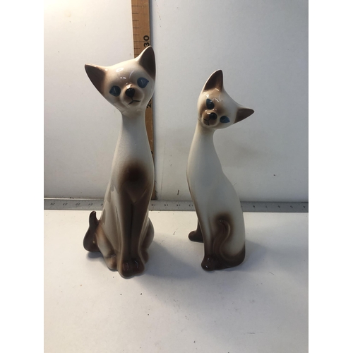 57 - Pair of china cats