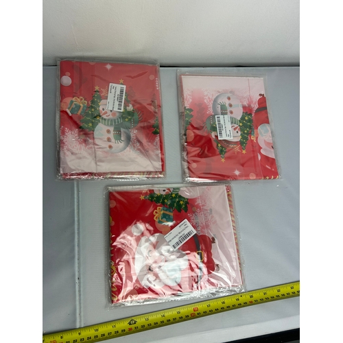 66 - 3 packs of Christmas Table covers - (2 in each pack)