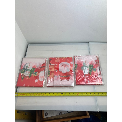 54 - 3 packs of Christmas Tablecloths (2 in each packet)