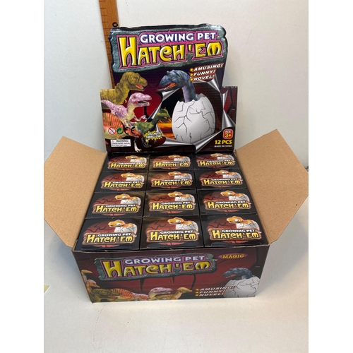 146 - 12 Growing Pet Hatch'Em toys. Each toy features a hatching dinosaur egg that grows when submerged in... 