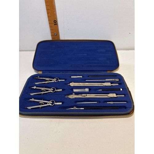 1 - Philmerco Nr. 404 compass set in a tan zippered case, marked 'Foreign.' Includes various drafting to... 