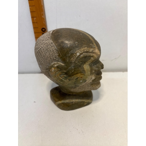 10 - Stone carved bust sculpture featuring a detailed human head. Material.
